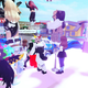 A bunch of Roblox characters jump on a brightly lit pink stage.